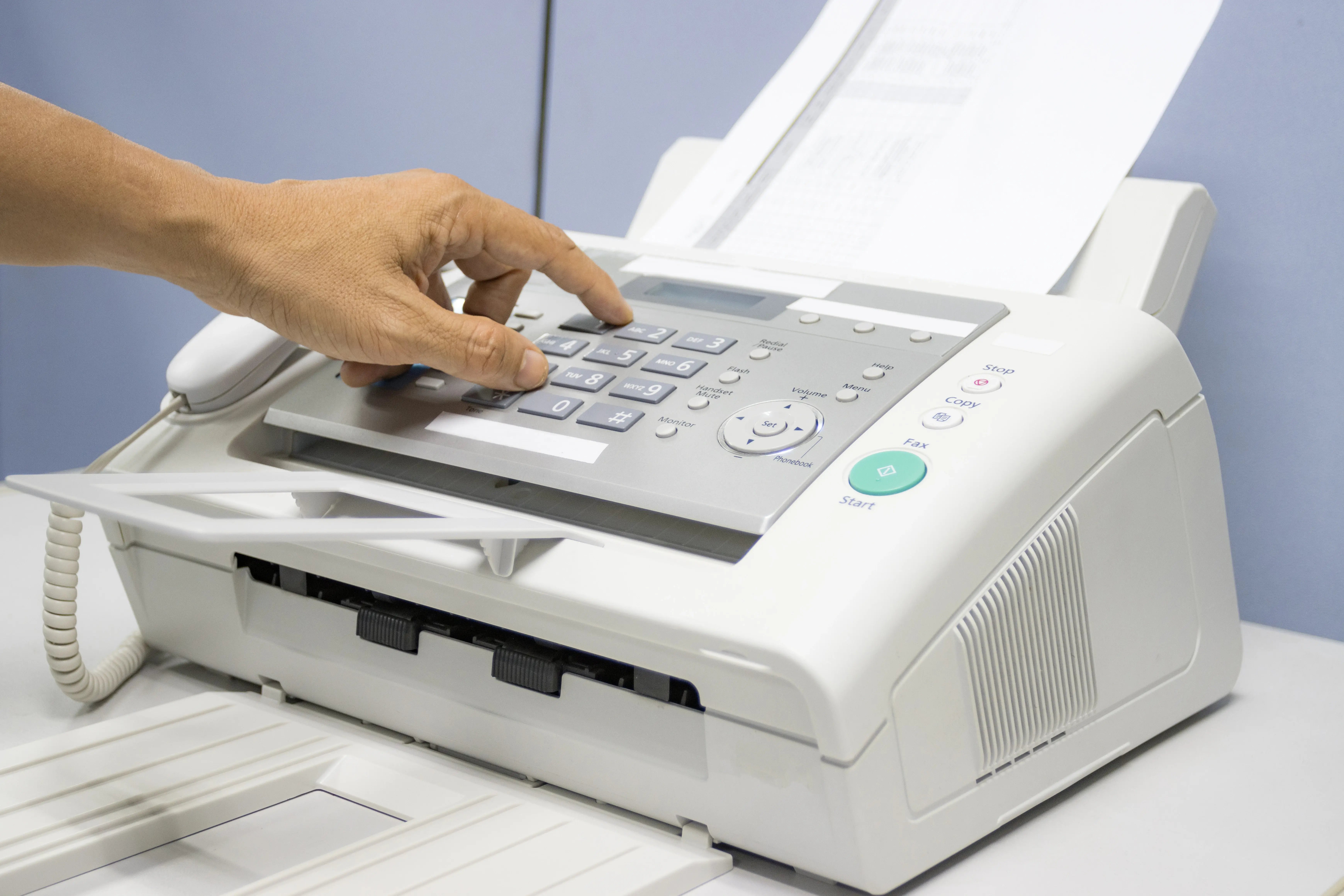 hand-man-are-using-a-fax-machine-in-the-office-eq-2026-01-06-09-37-46-utc
