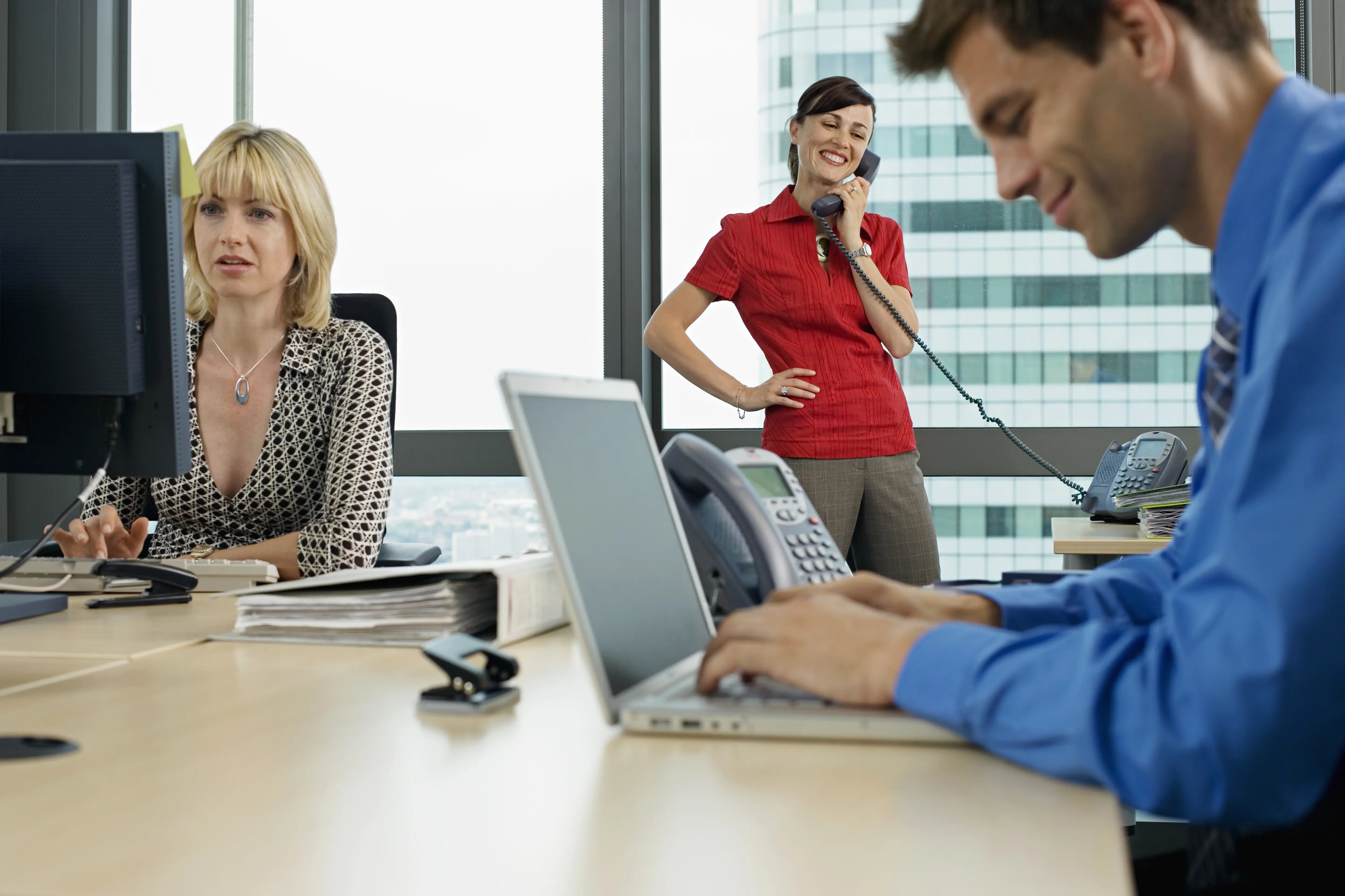 three-business-people-working-in-office-man-using-2026-03-26-03-49-09-utc