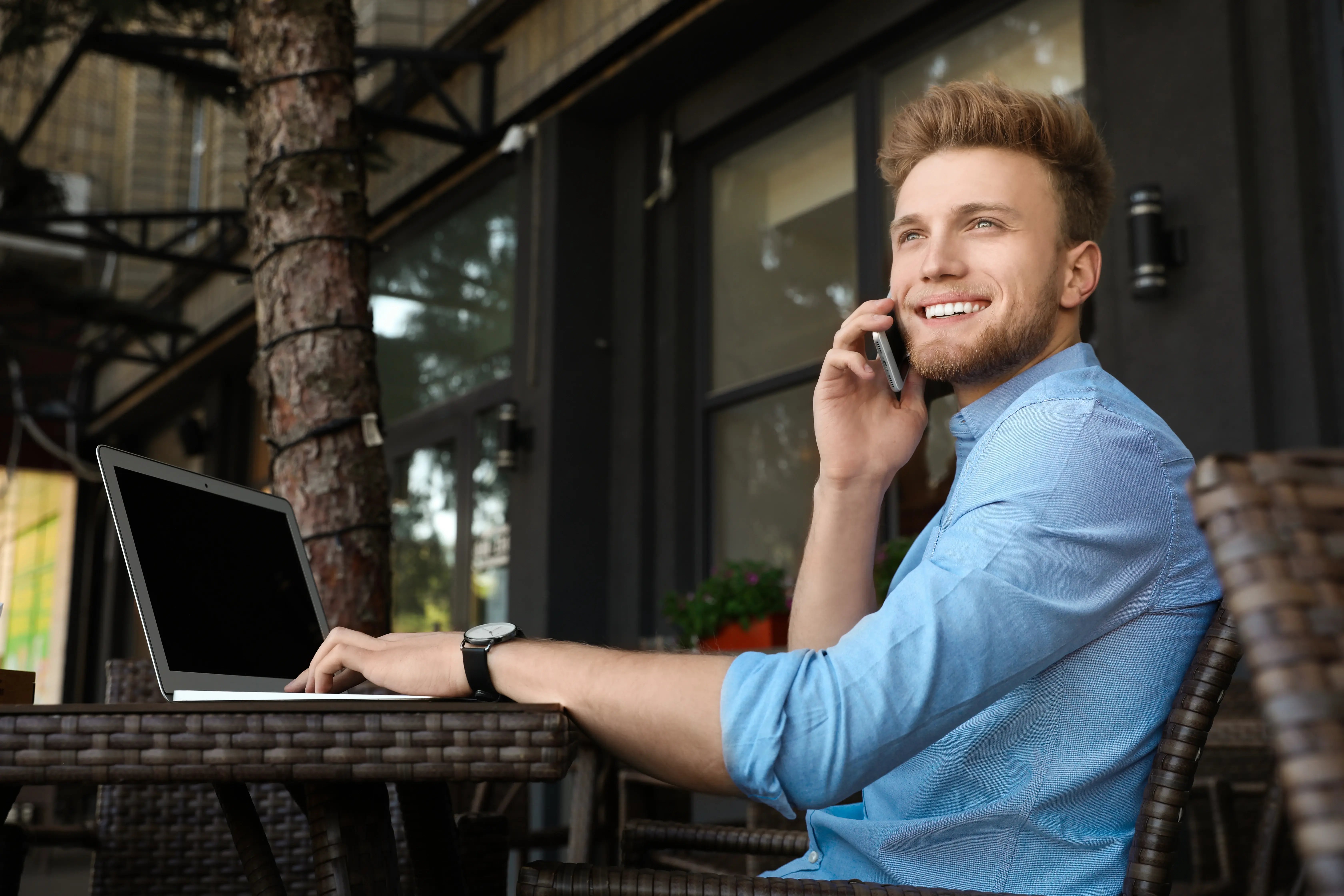 handsome-young-man-with-laptop-sitting-at-table-in-2026-06-16-06-29-53-utc