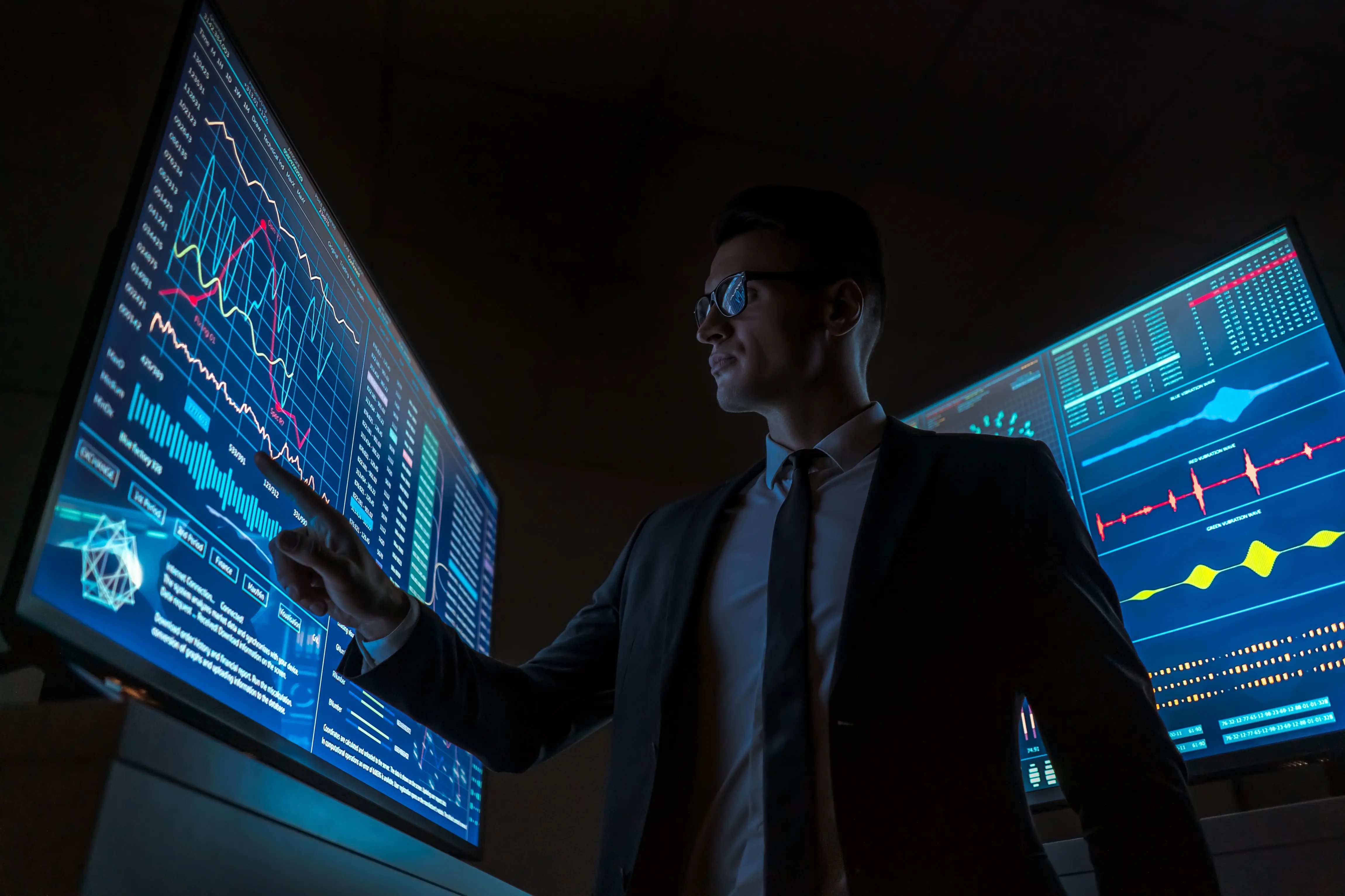 man-analyzing-business-data-on-multiple-computer-s-2026-03-17-14-41-48-utc