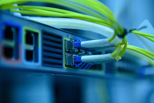 Close-up of Ethernet cables connected to network equipment for a high-speed leased line connection.